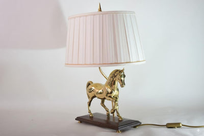 Bring equestrian elegance into your home with this vintage brass horse table lamp