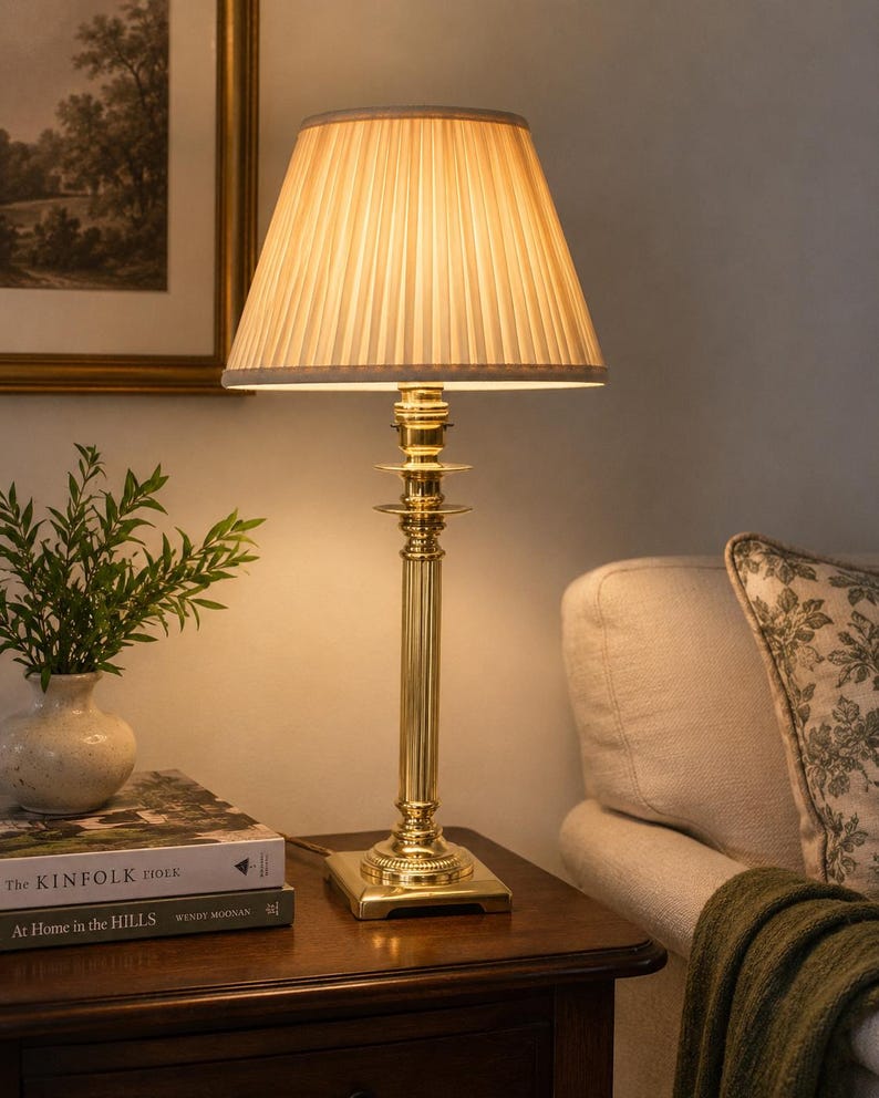 English-made brass column table lamp with fluted stem and neoclassical detailing.
