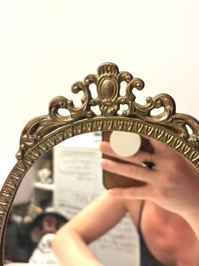This mirror is absolutely stunning, amazing details and intricate metal work. L