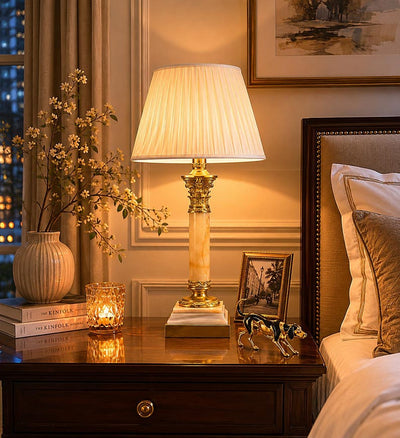 A beautiful early 20th-century table lamp crafted from elegant marble and richly detailed gilt bronze mounts.