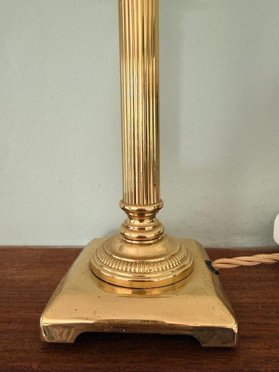 English-made brass column table lamp with fluted stem and neoclassical detailing.