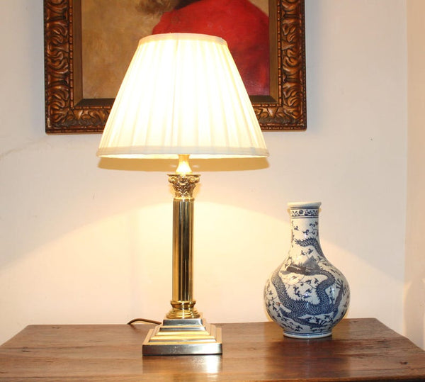 A lovely vintage brass Corinthian column table lamp supplied with a new (country house) style 12'' knife pleat lampshade in cream. Perfect for a stylish country or city residence.