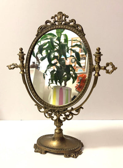This mirror is absolutely stunning, amazing details and intricate metal work. L
