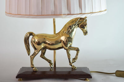 Bring equestrian elegance into your home with this vintage brass horse table lamp