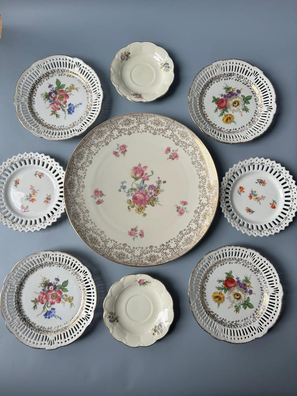 Set of 9 vintage plates. 5 different patterns and 4 different sizes. Colorful floral motif with ornate golden color accents. 6 plates with reticulated edges. Wall display decor. Vintage floral transferware. Mismatched.