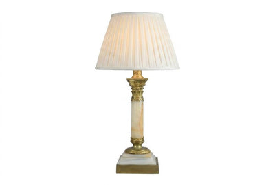 A beautiful early 20th-century table lamp crafted from elegant marble and richly detailed gilt bronze mounts.