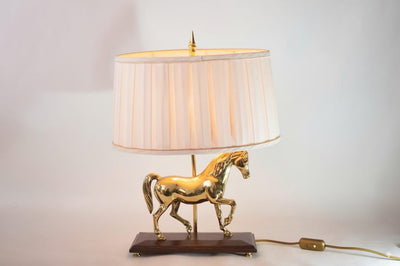 Bring equestrian elegance into your home with this vintage brass horse table lamp
