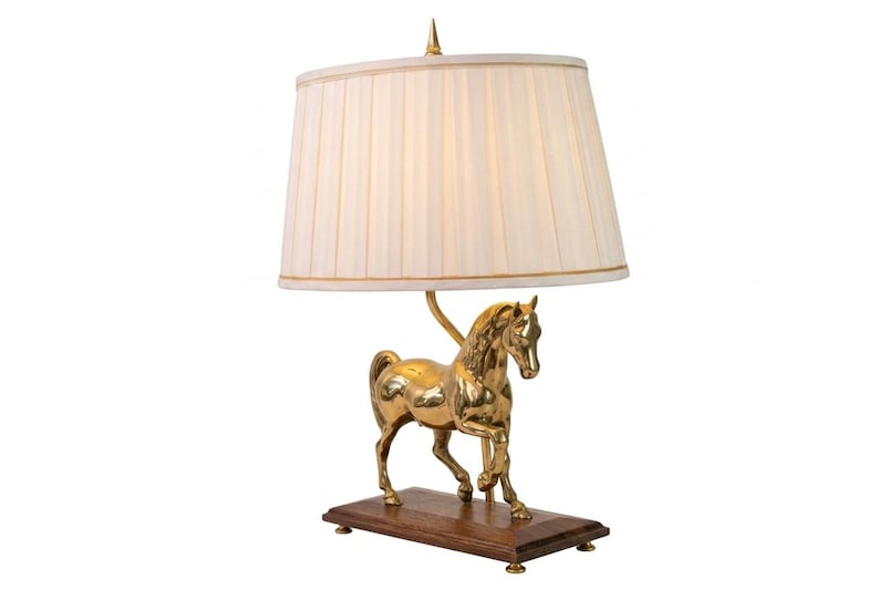 Bring equestrian elegance into your home with this vintage brass horse table lamp